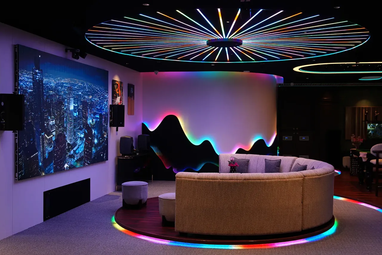 USK spatial audio room with radial LED ceiling and curved listening sofa